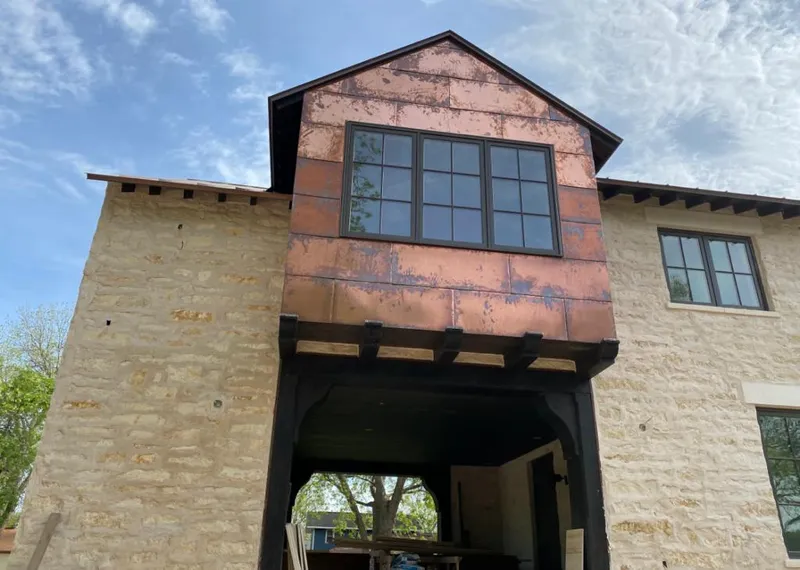 Copper metal panel facade on a stone building for Metal Roof Coating in Wildomar