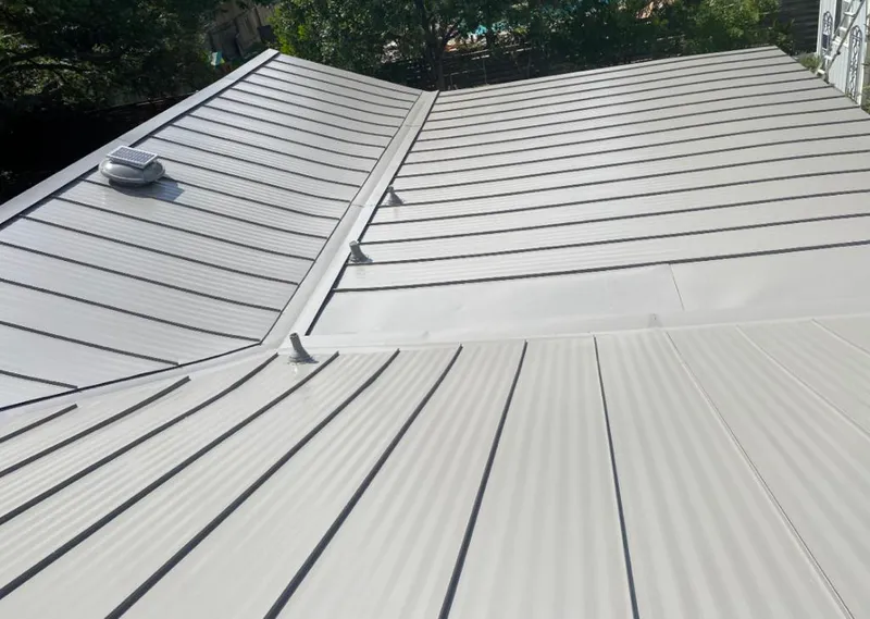 Solar attic fan installed on a metal roof for Roof Ventilation in Wildomar